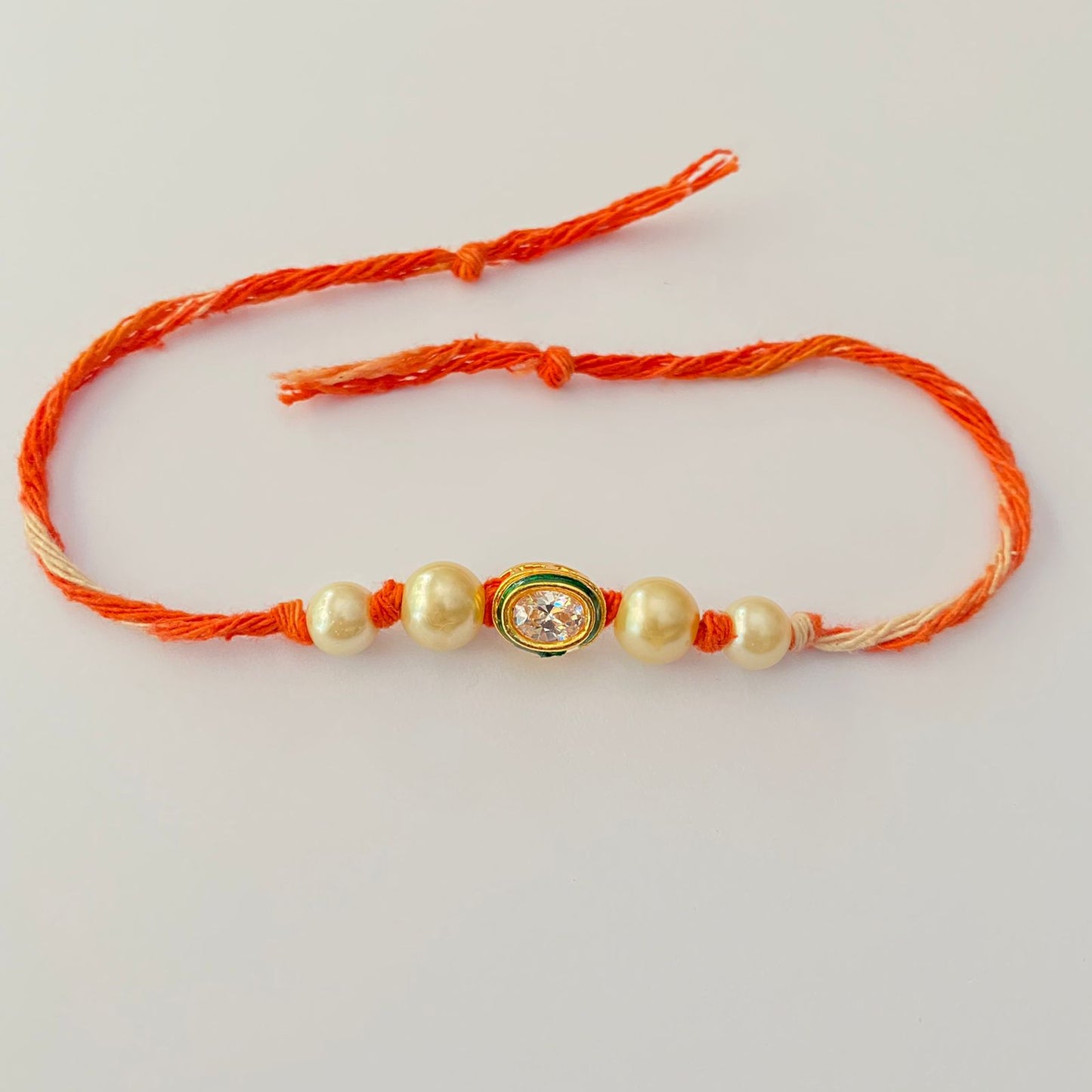 KUNDAN POLKI WHITE PEARL RAKHI