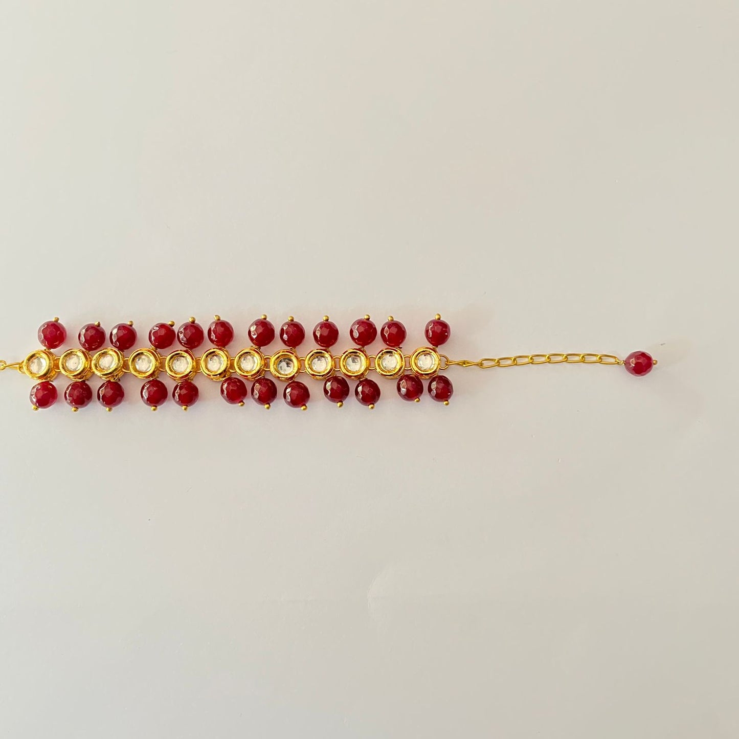 Gold Plated Oval Shape Kundan Ruby Pearl Bracelet