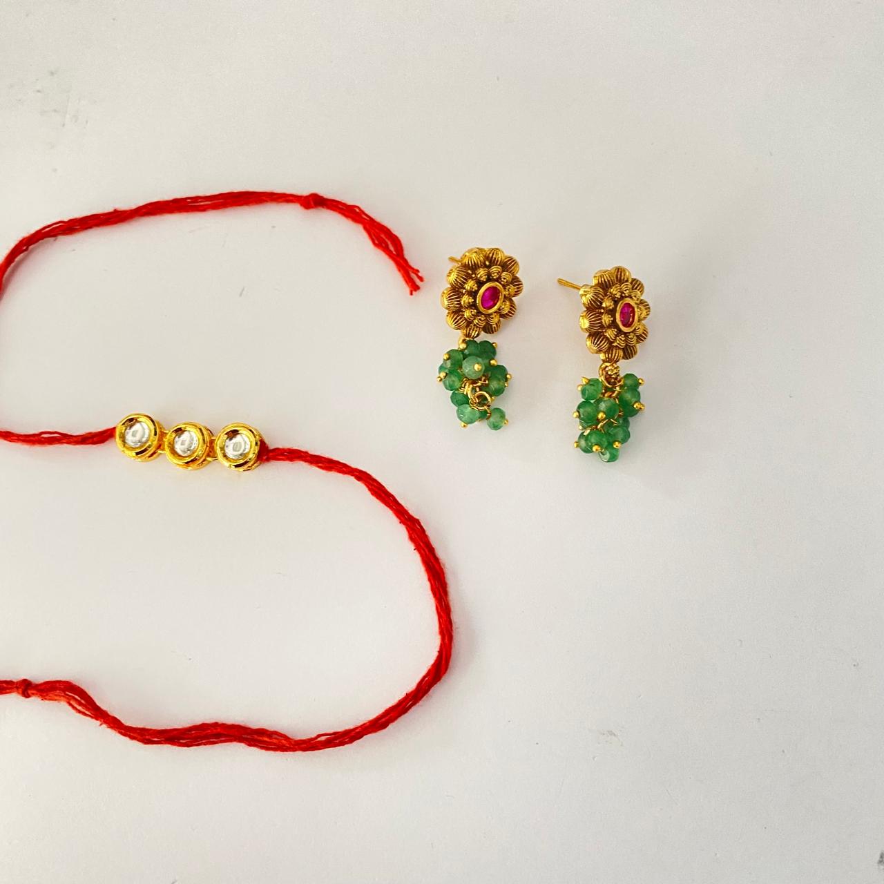 Round Shape Gold Plated Kundan Rakhi with Ruby & Emerald Gold Palted Earring Combo