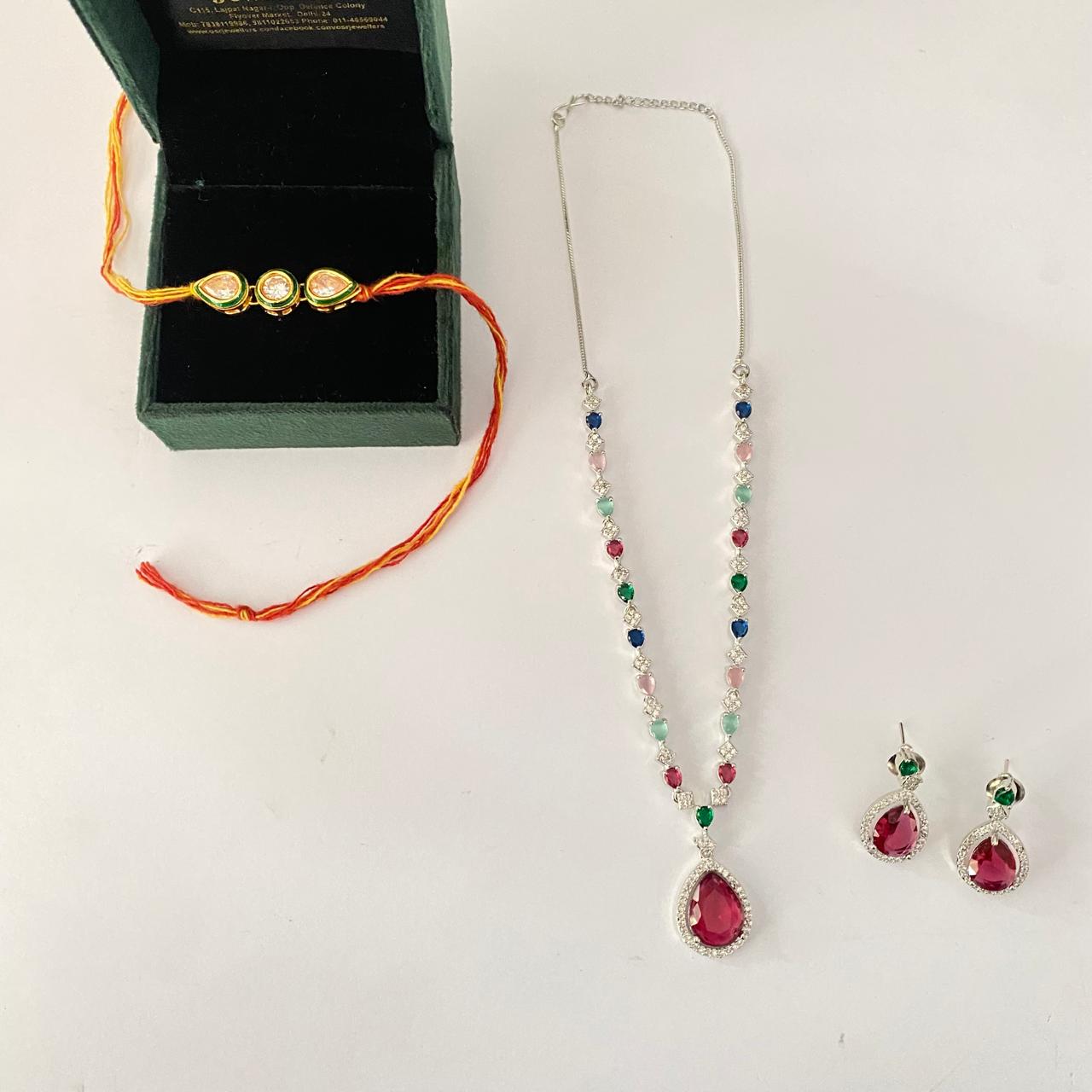 Teardrop and Round Shape Kundan Rakhi with Multi Color Diamond Silver Plated Necklace Set Combo
