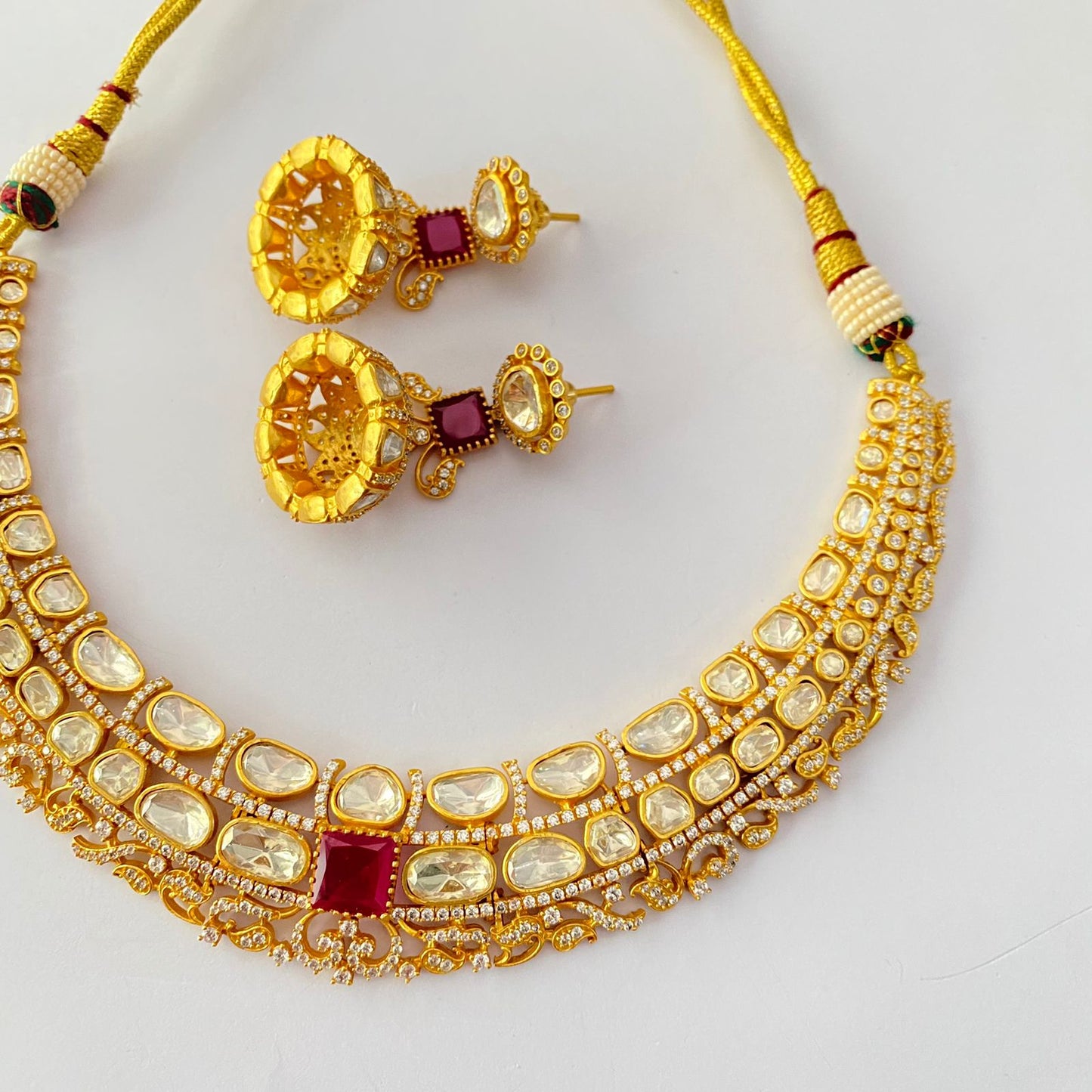 Gold Plated kundan ruby with diamond necklace set.