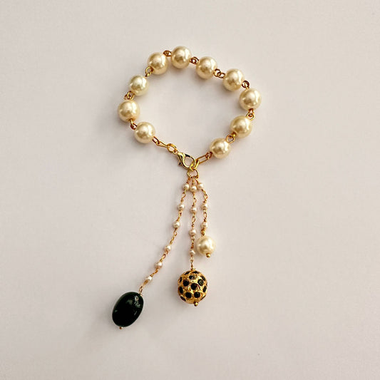 OFF-WHITE PEARL GOLD PLATED CHAIN WITH BLACK STONE HANGING LUMBA RAKHI