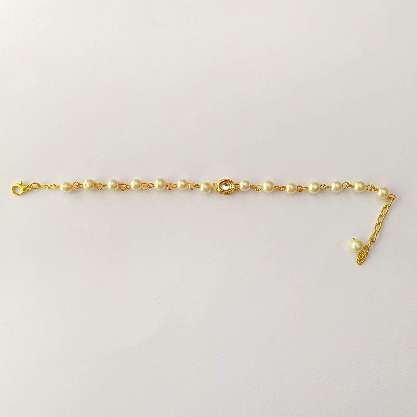 white pearl polki with plated gold plated chain lumba rakhi