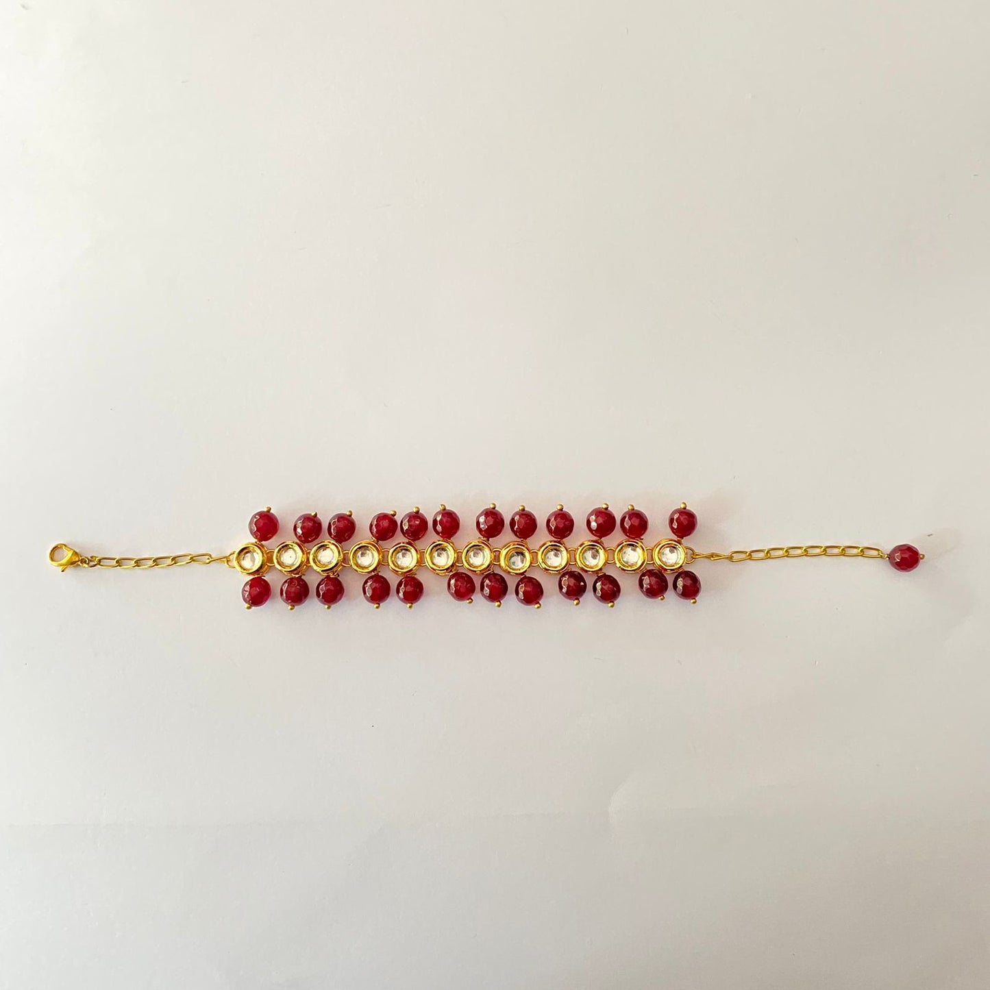 Gold Plated Oval Shape Kundan Ruby Pearl Bracelet
