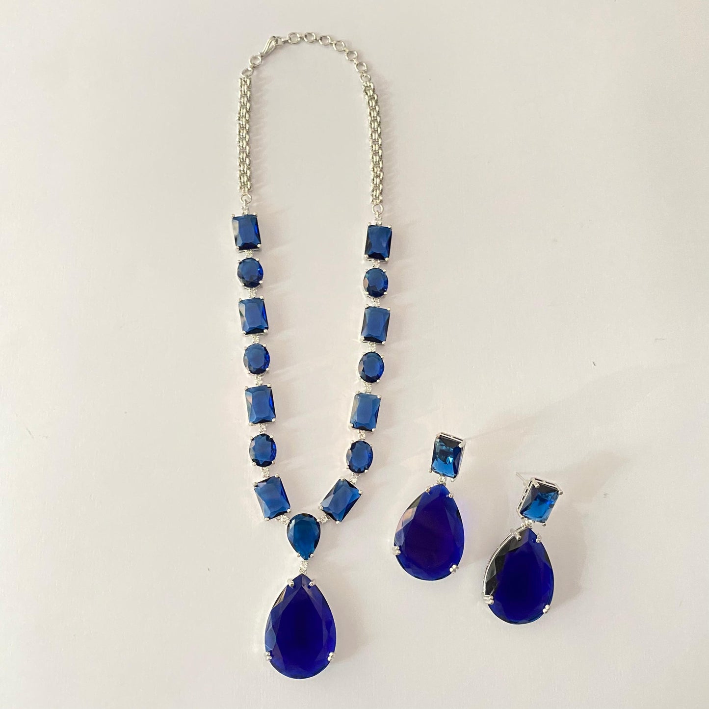 Dazzling Blue Stone Studded Necklace Set in Silver Plated