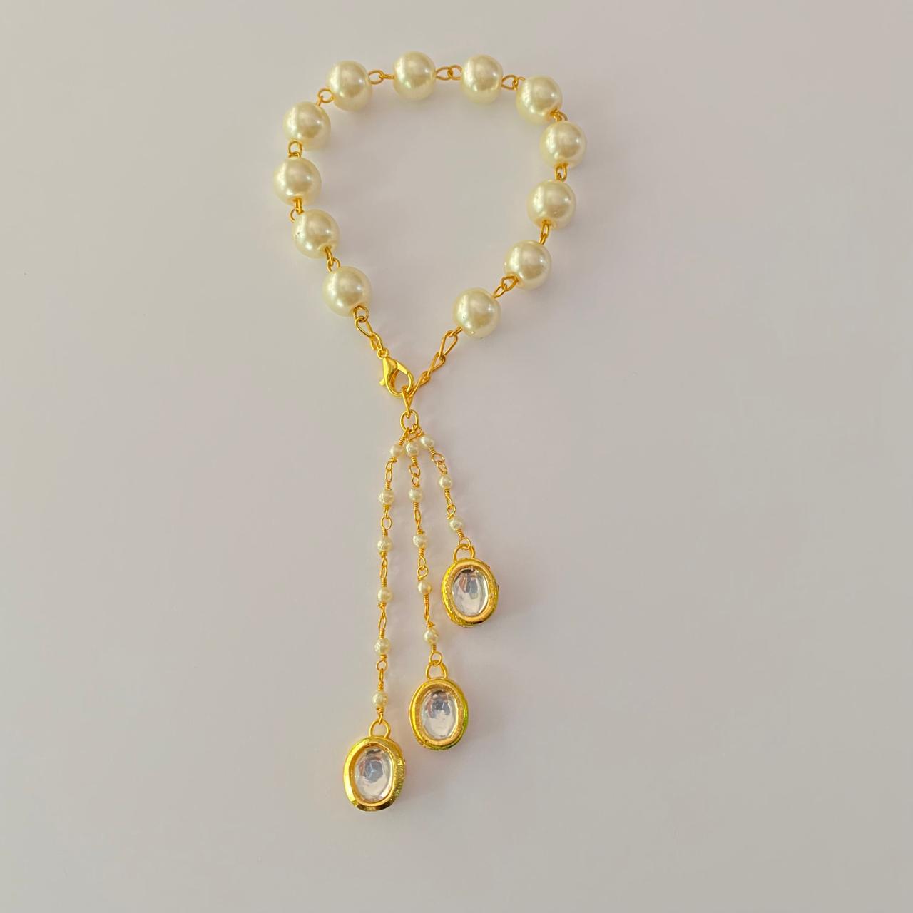 OFF-WHITE PEARL  GOLD PLATED CHAIN LUMBA RAKHI FOR WOMEN