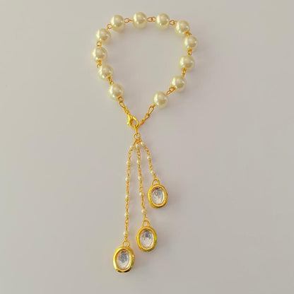 OFF-WHITE PEARL  GOLD PLATED CHAIN LUMBA RAKHI FOR WOMEN
