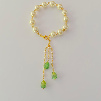 GOLD PLATED CHAIN PEARL WITH MINT GREEN LUMBA RAKHI FOR WOMEN