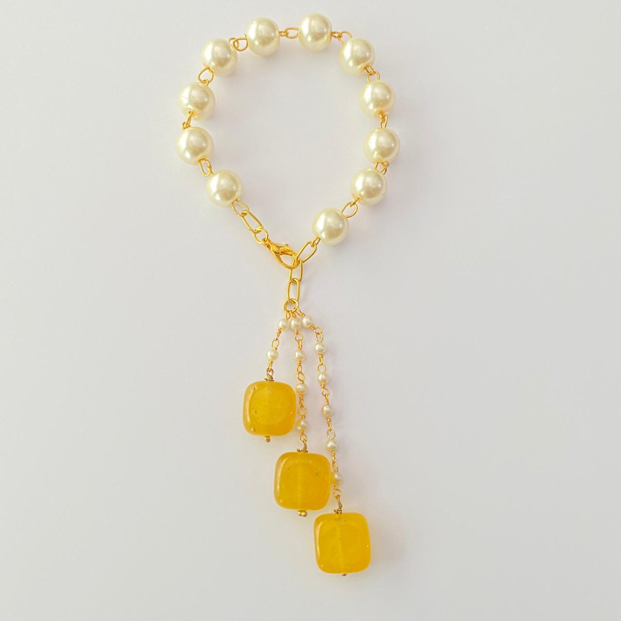 PEARL LUMBA RAKHI WITH YELLOW DROP STONE FOR WOMEN