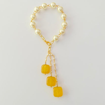 PEARL LUMBA RAKHI WITH YELLOW DROP STONE FOR WOMEN