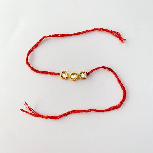 Round Shape Gold Plated Kundan Rakhi