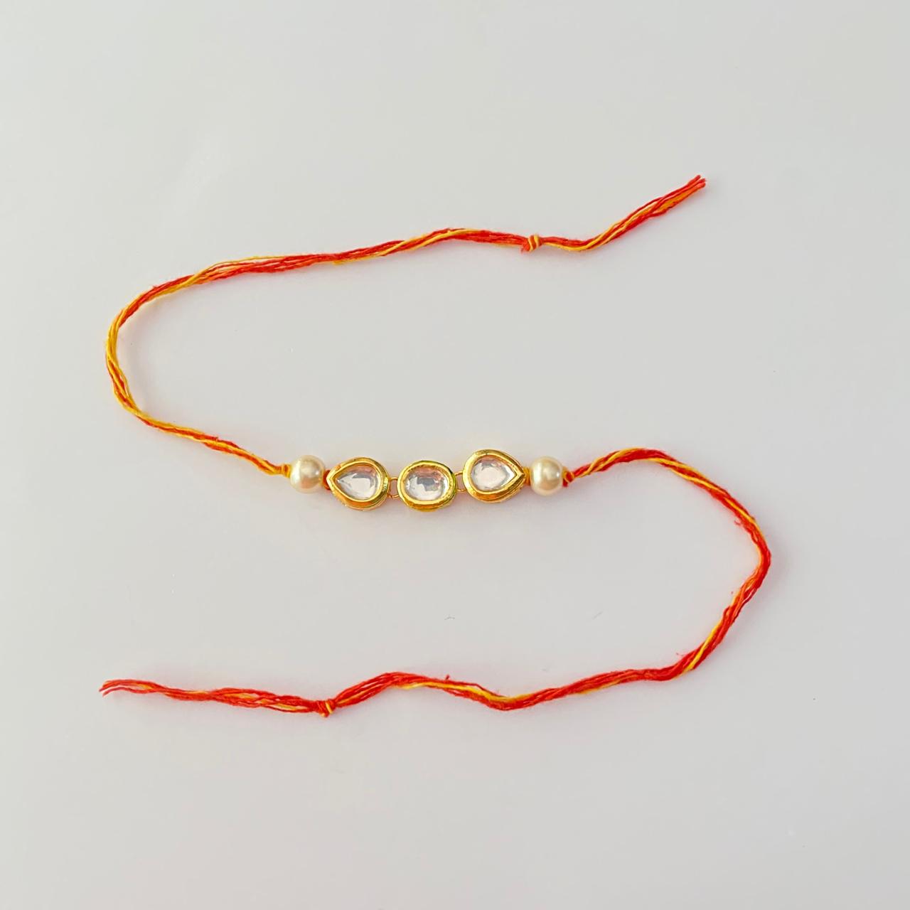 Center Round Shape Kundan and Teardrop Kundan with Pearl Rakhi