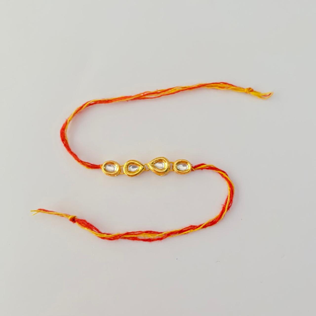 Teardrop shaped and Oval Shaped Gold Plated Kundan Rakhi