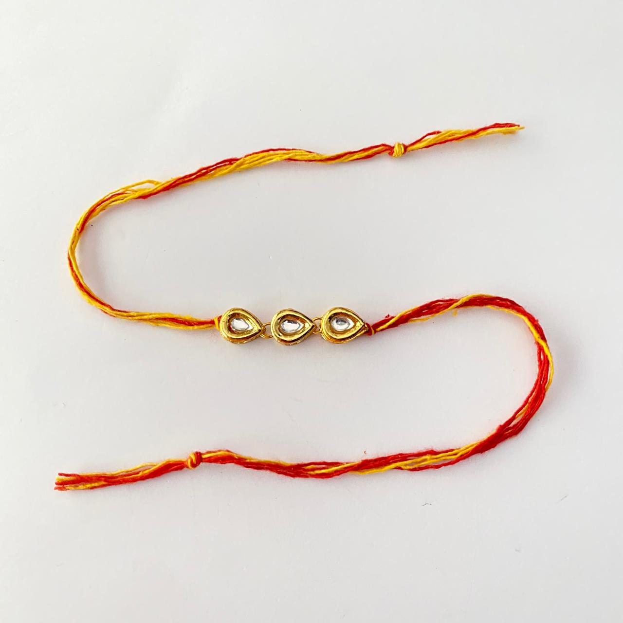 Teardrop Shape Gold Plated Kundan Rakhi