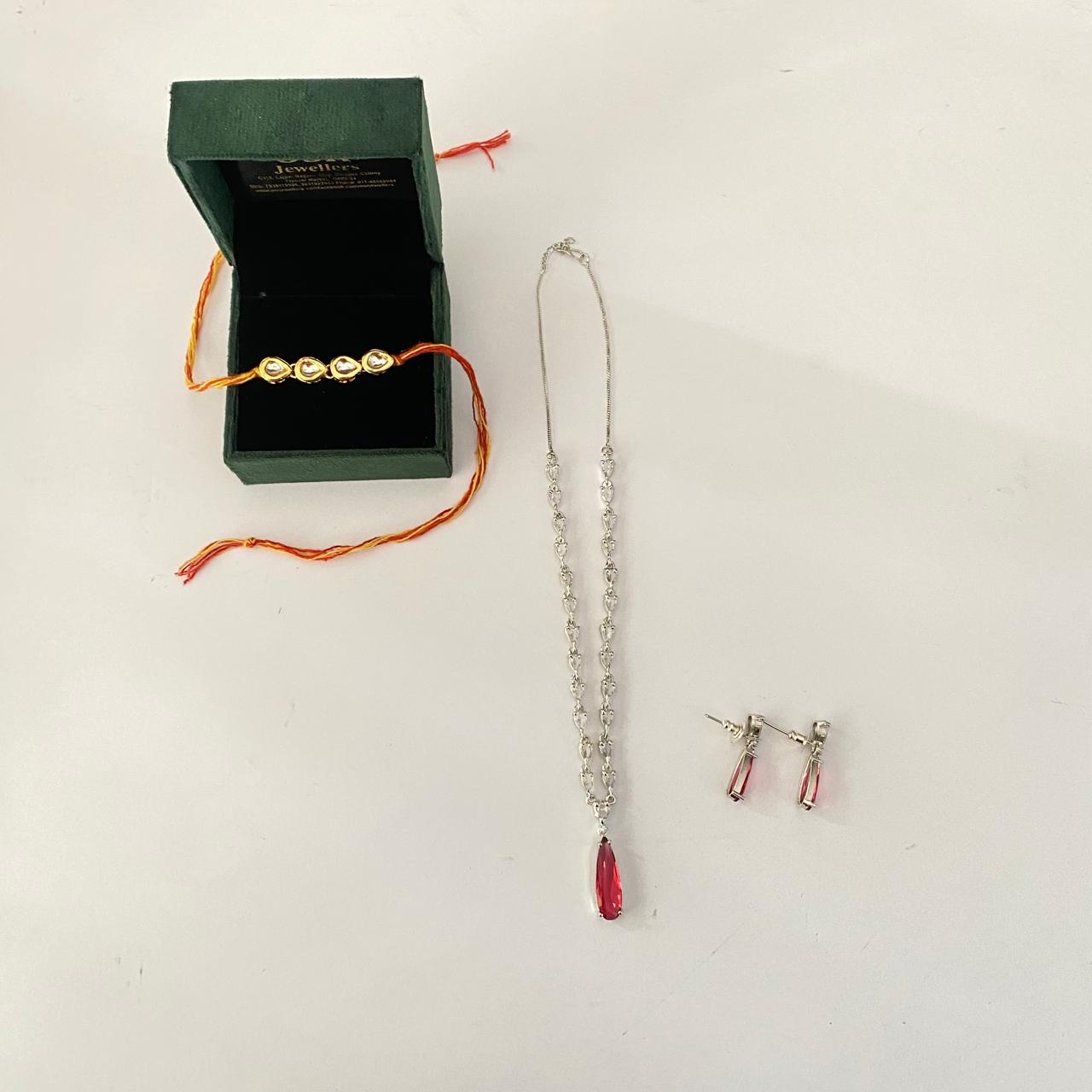 Four Teardrop Kundan Rakhi with Ruby Silver Plated Diamond Necklace Set Combo