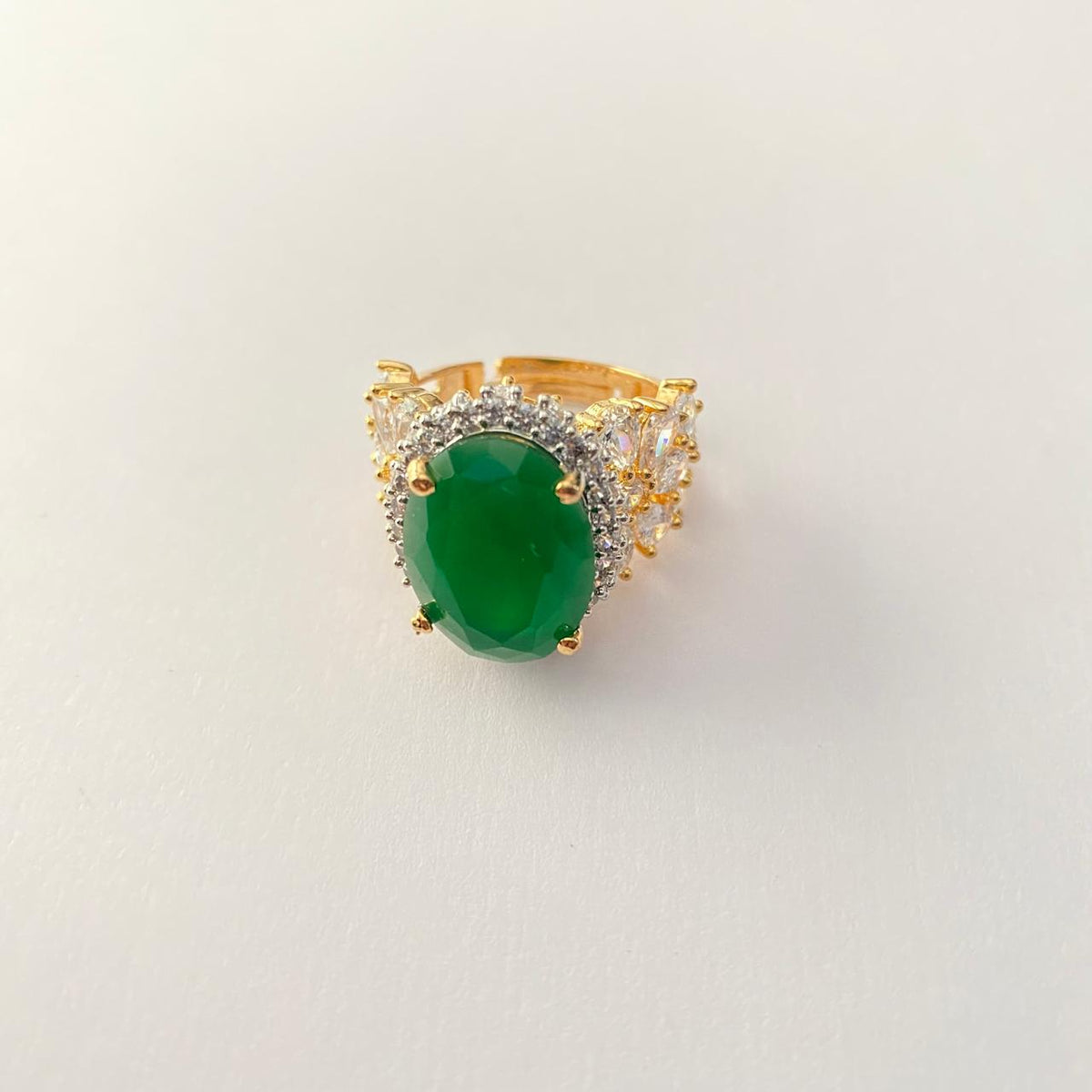 Oval Green Center Stone Surrounded by Small Diamond Gold Plated Ring
