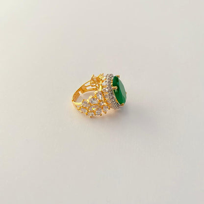 Oval Green Center Stone Surrounded by Small Diamond Gold Plated Ring